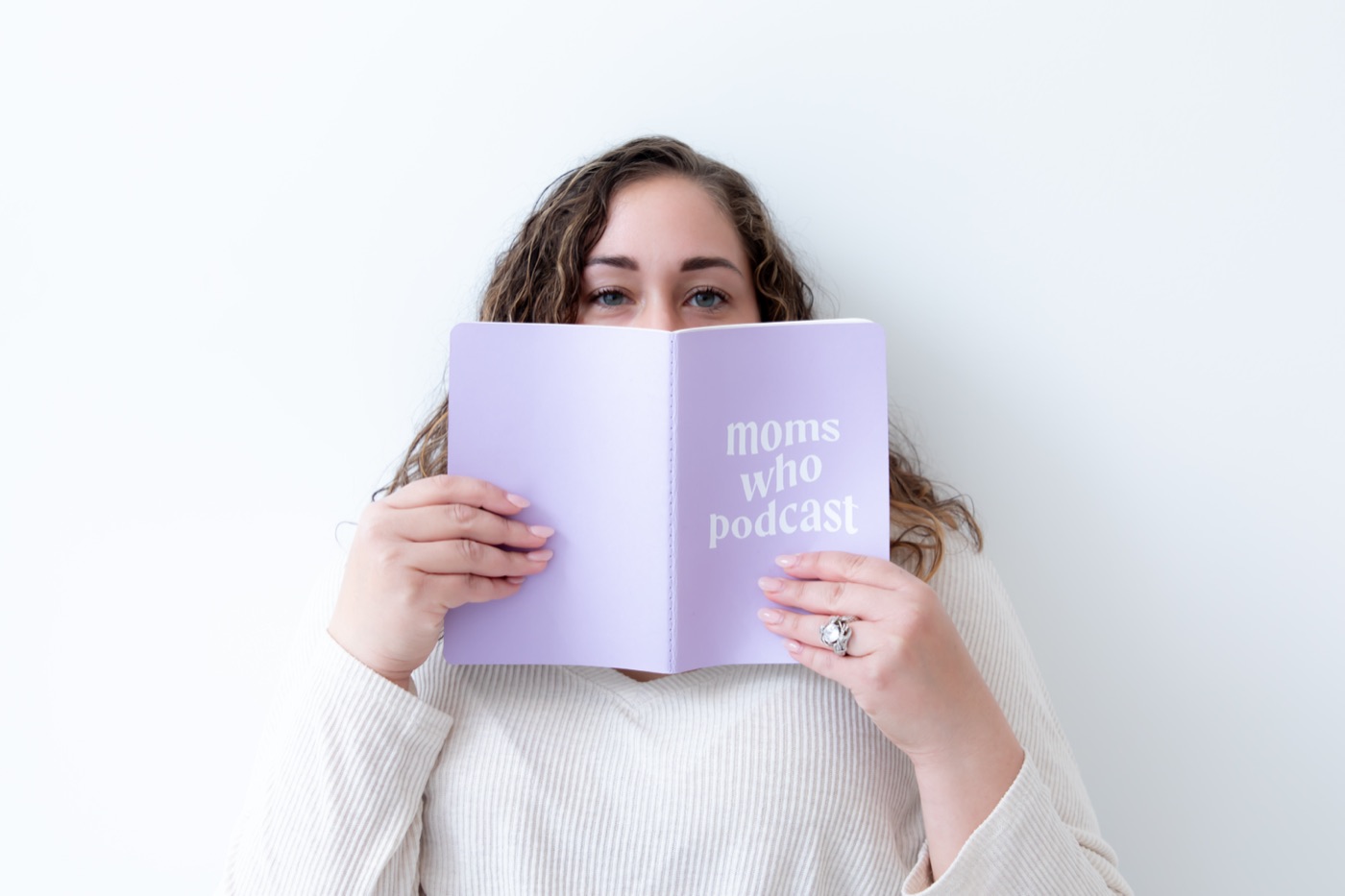 Pamela peeking over her notebook